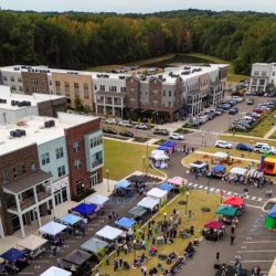 image showing people attending outdoor art festival.