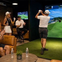 players playing golf indoors