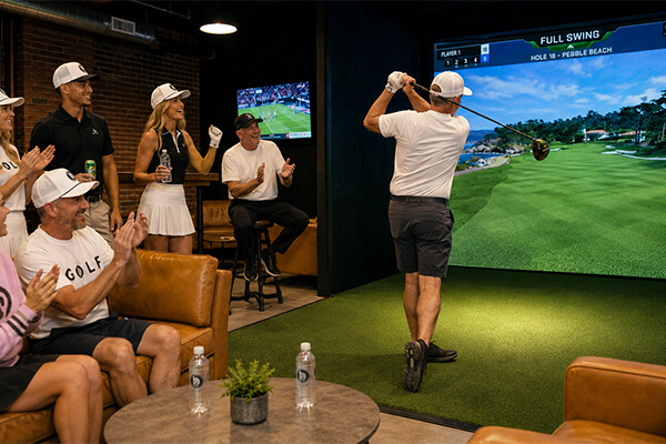 players playing golf indoors